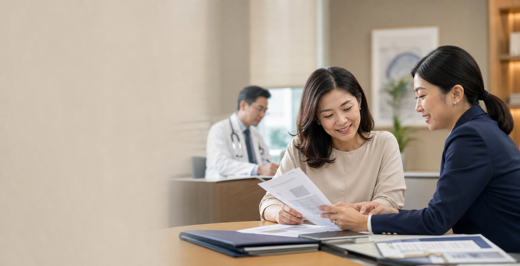 Malaysian client reviewing a successful medical claim outcome with an adviser